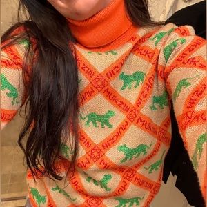 Mukzin orange and gold turtleneck sweater